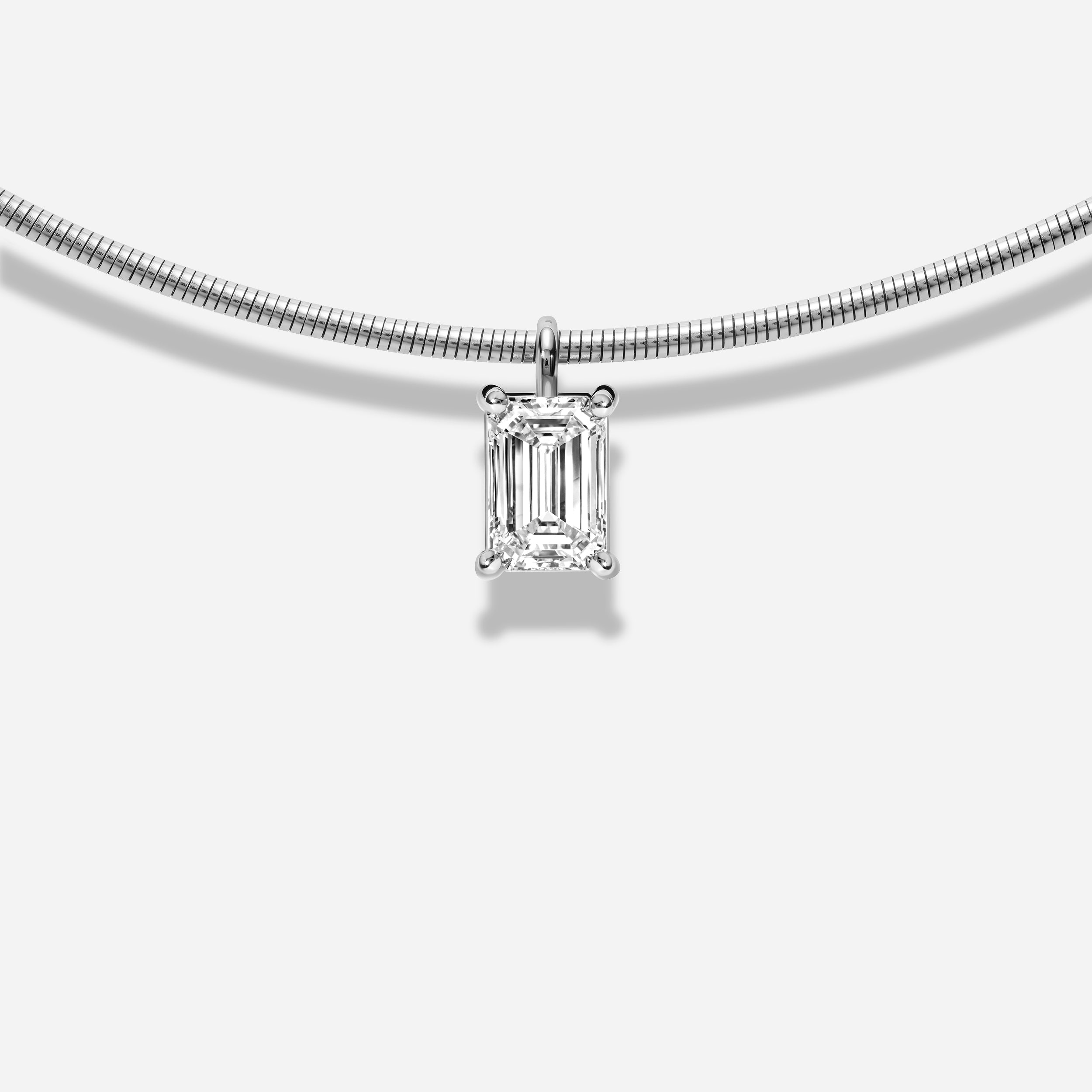 18K GOLD EMERALD CUT DIAMOND