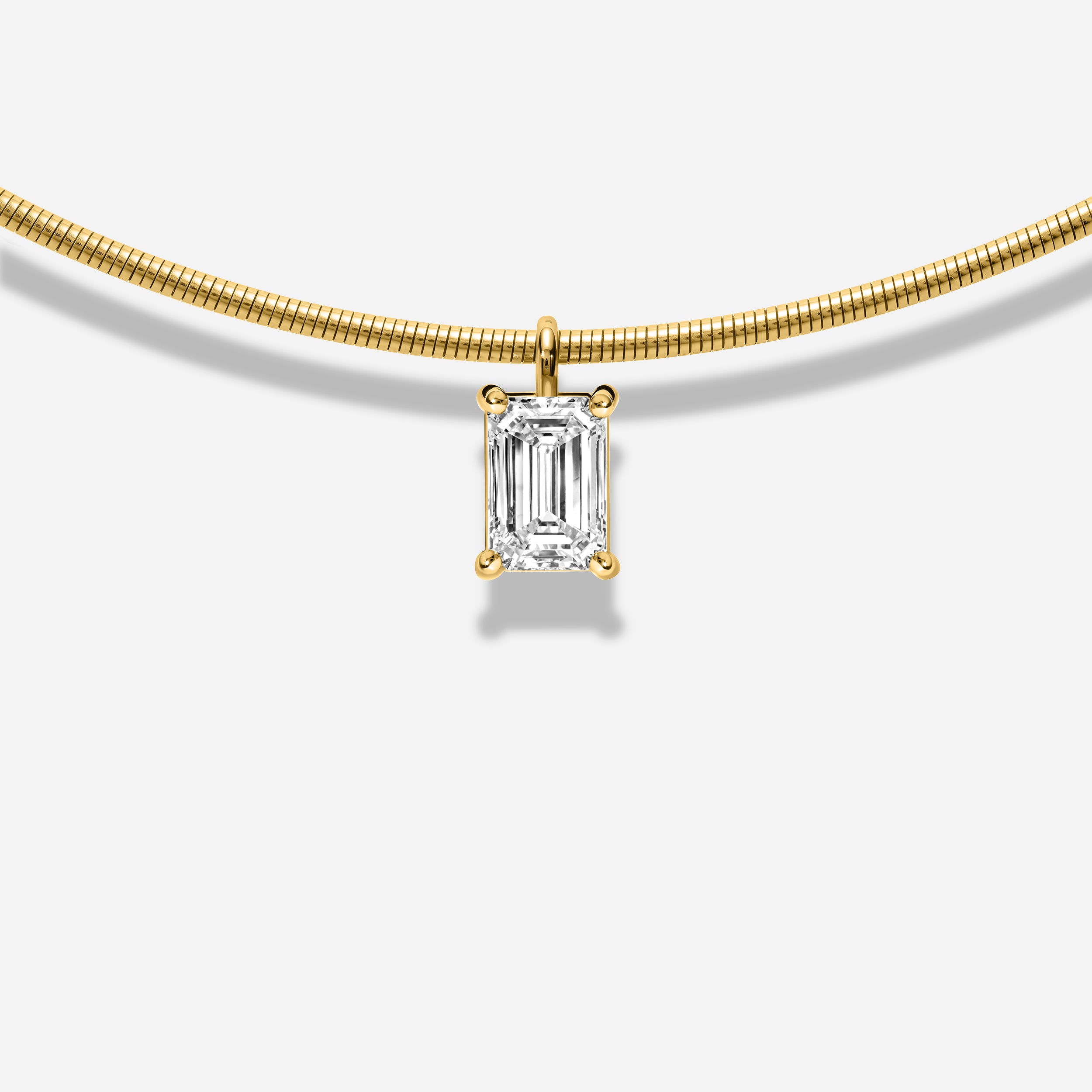 18K GOLD EMERALD CUT DIAMOND