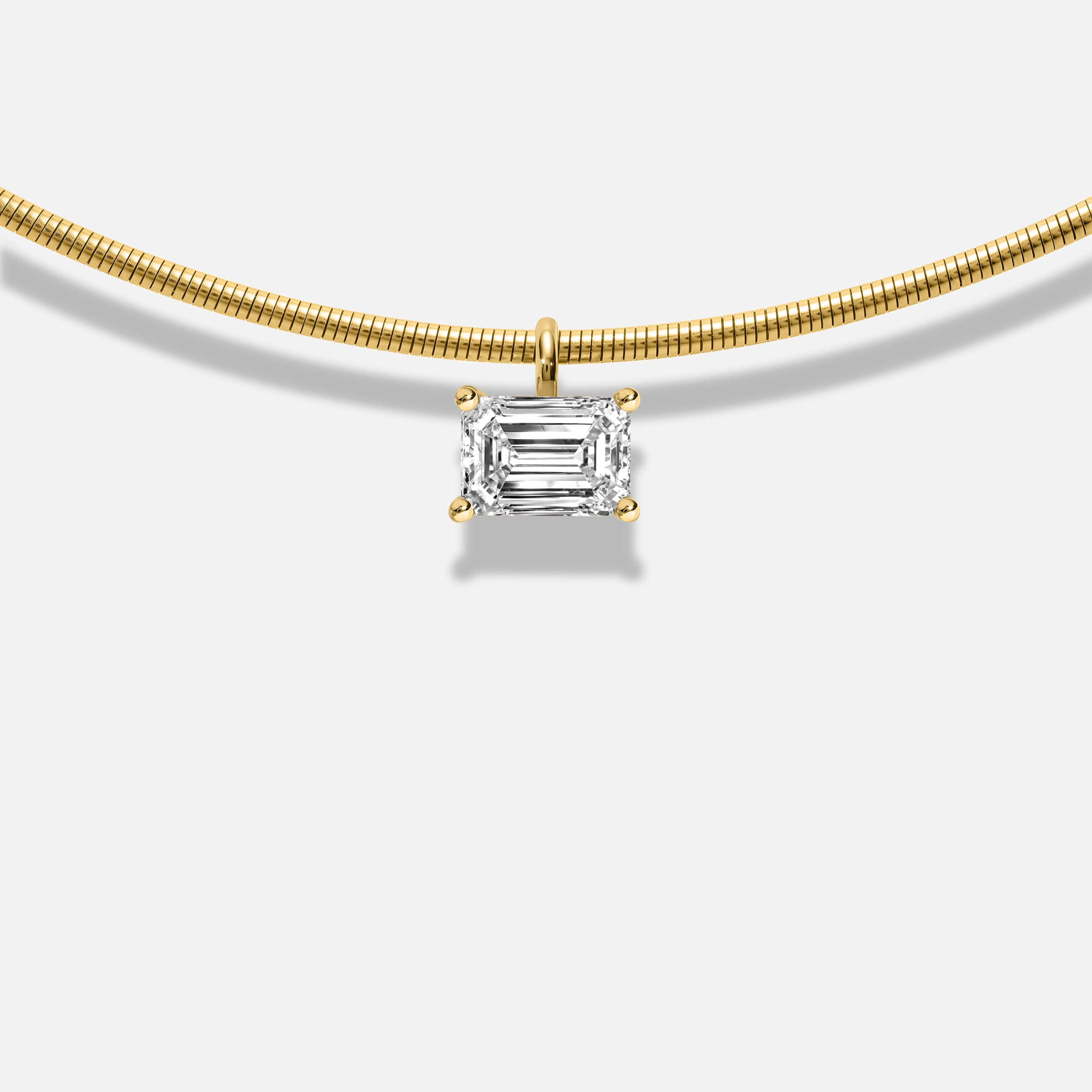 18K GOLD EMERALD EAST WEST DIAMOND