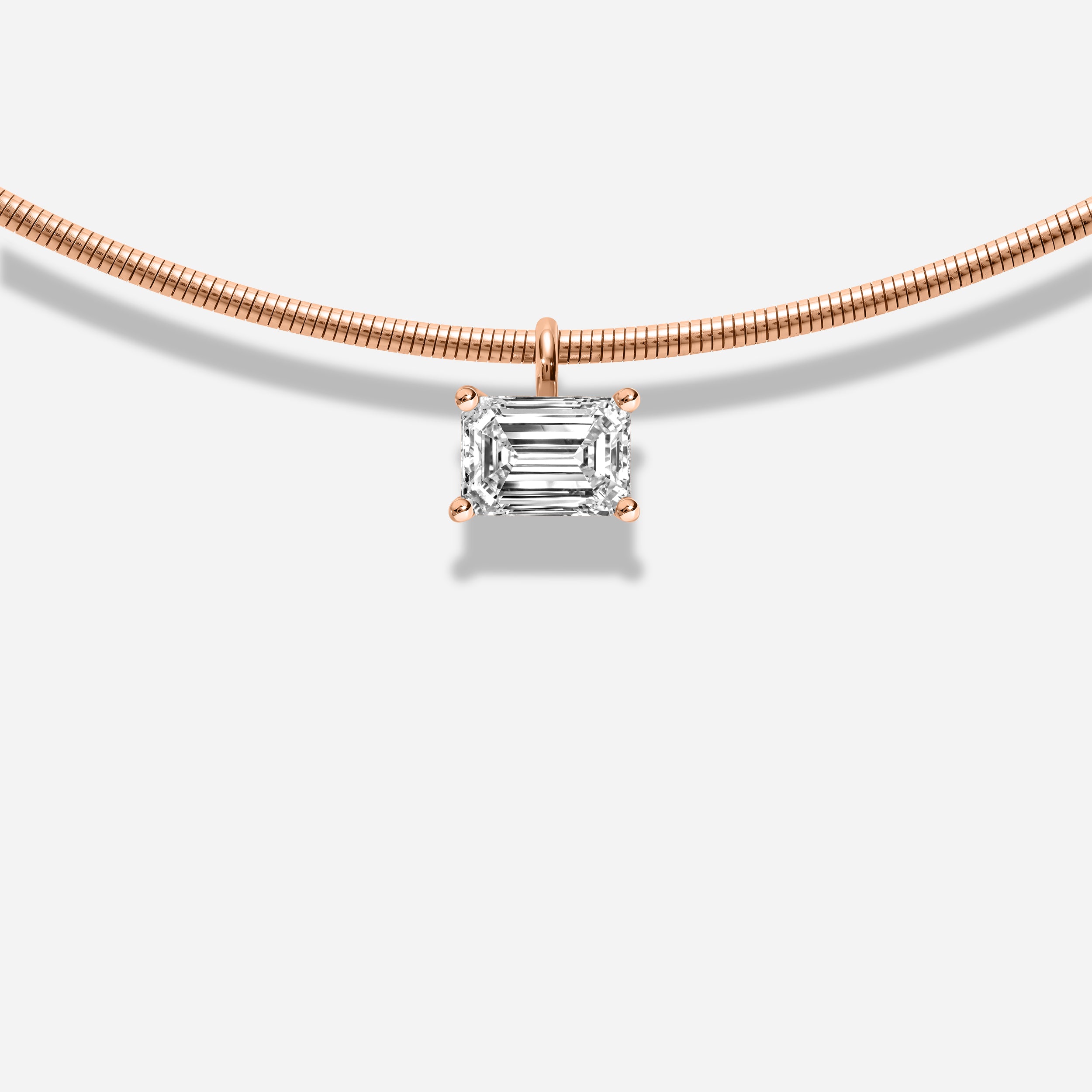 18K GOLD EMERALD EAST WEST DIAMOND