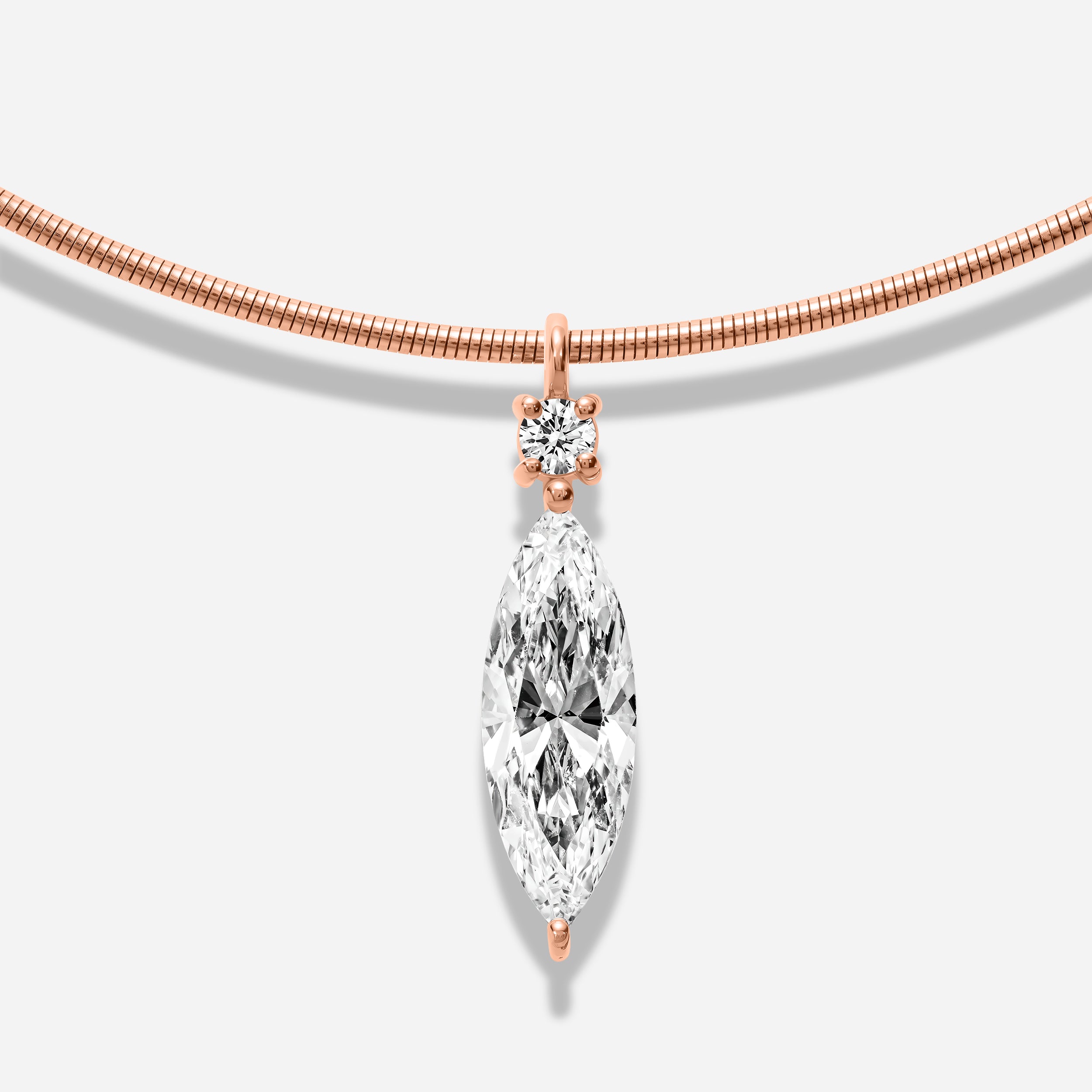 18k GOLD MARQUISE AND ROUND SHAPE DIAMOND