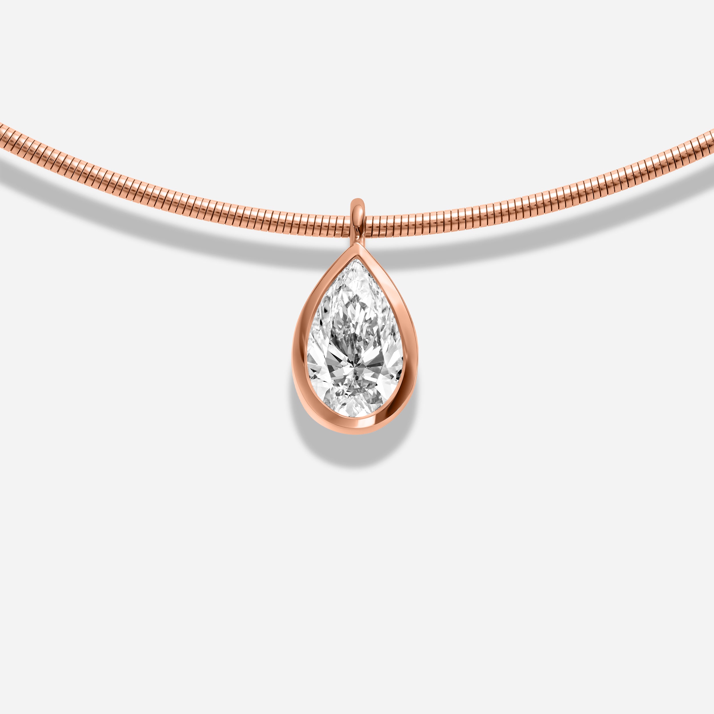 18k GOLD PEAR SHAPE BEZEL DIAMOND